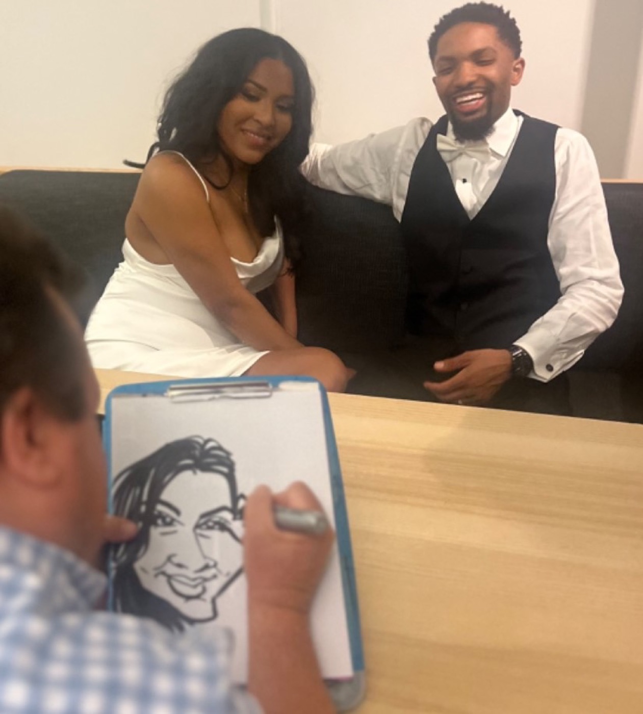 Paul drawing a couple live at their event